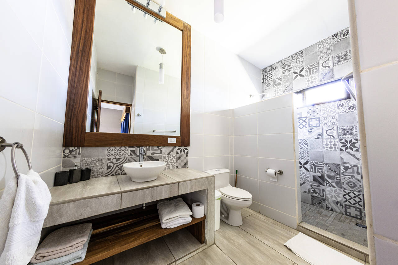 Large and well lit bathroom with lovely features